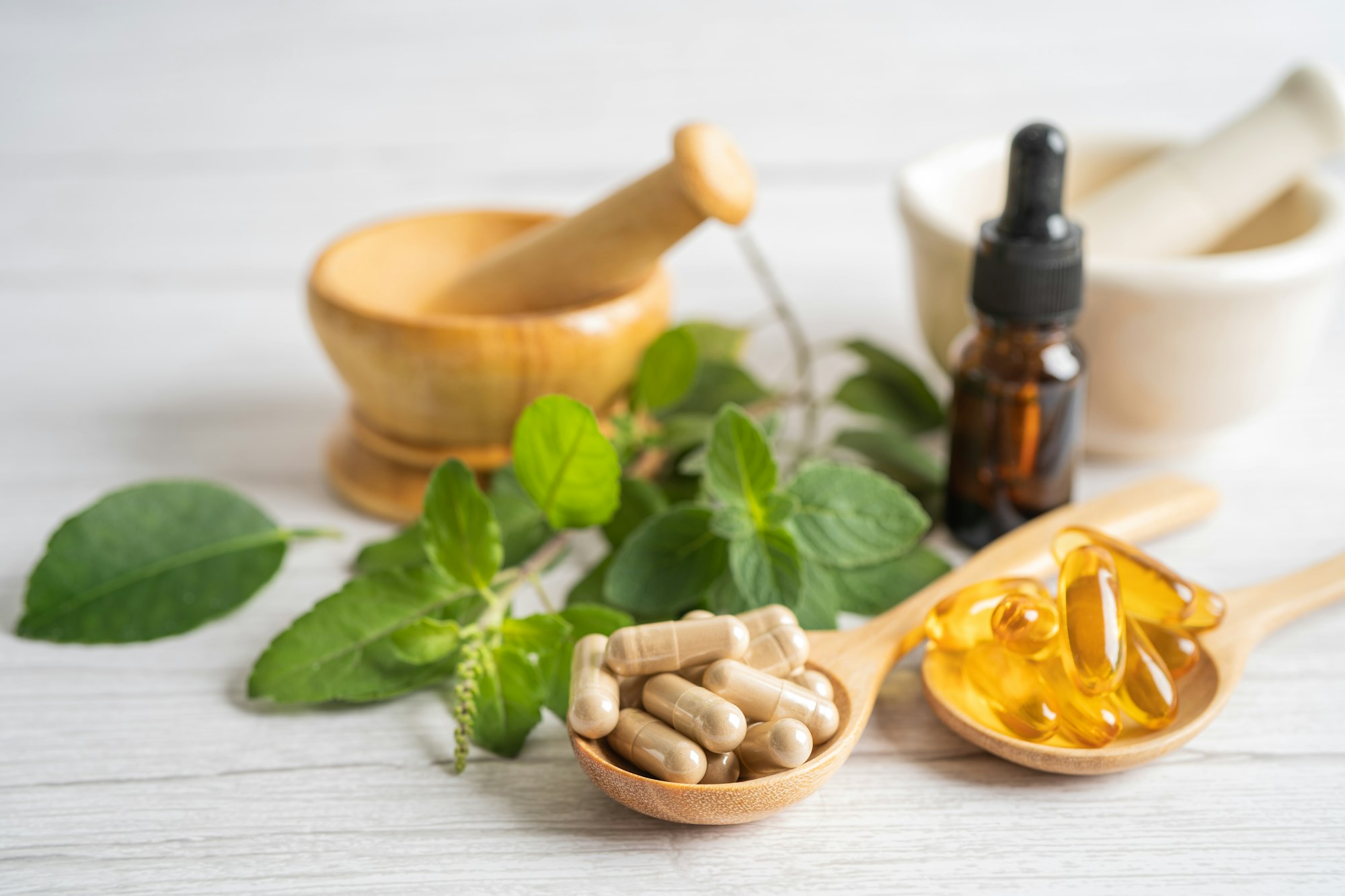 Alternative medicine herbal organic capsule drug with herbs leaf natural